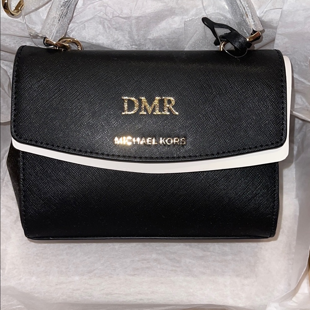 Michael Kors Black Crossbody Bag with Gold Hardware and Flap Closure